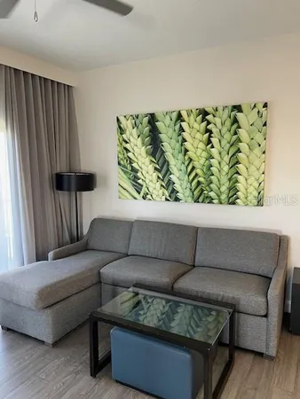 a living room with furniture and a window