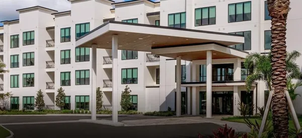 a front view of a building with street view