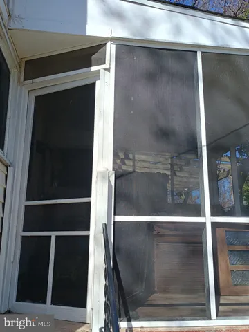 a view of a chairs and tables in the back yard of the house
