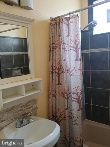 a bathroom with a toilet and shower