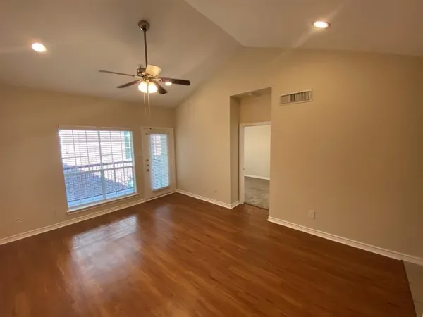 a view of an empty room with a window