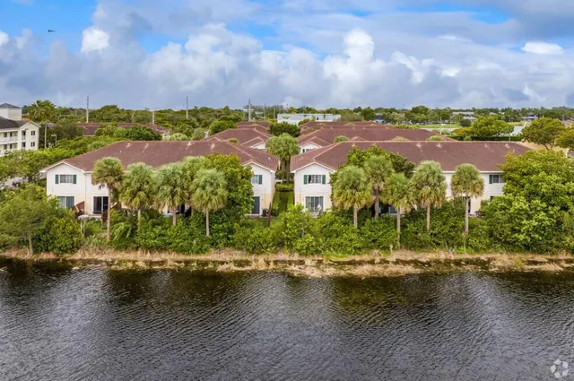 an aerial view of residential building with swimming pool and outdoor space