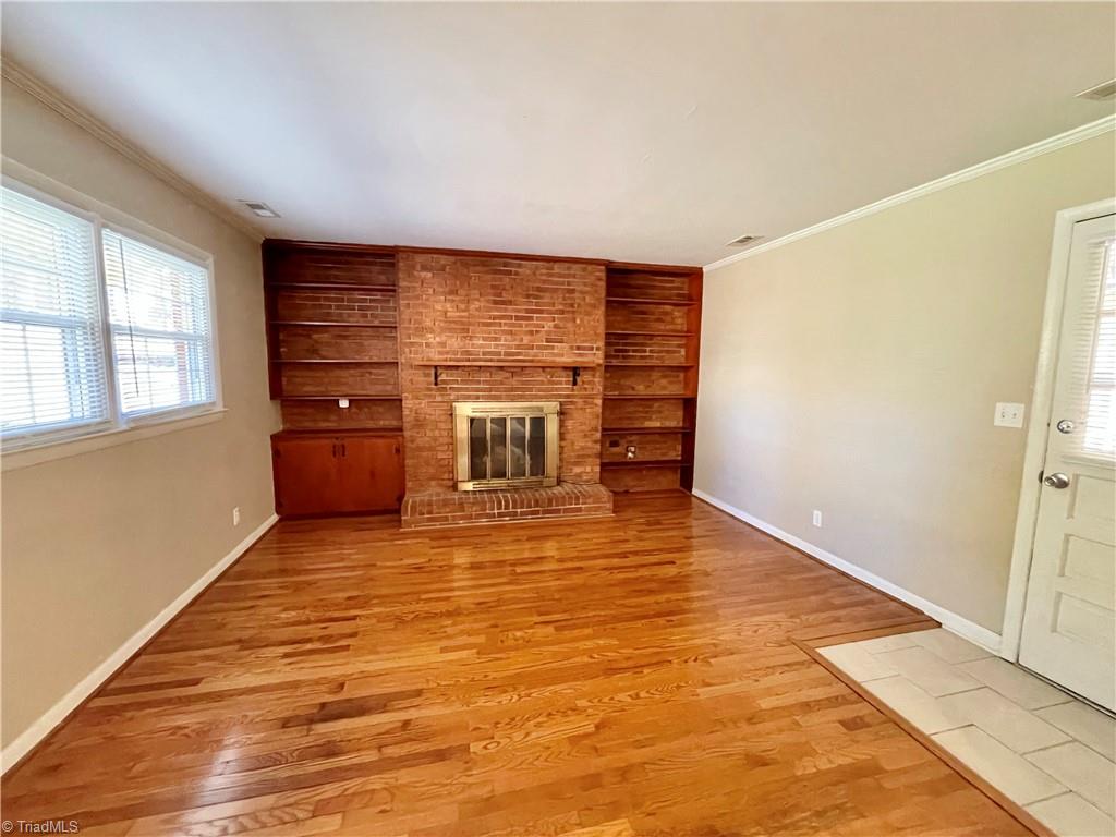 575 Alpine Road Winston-Salem, NC 27104 - Photo 11 of 28 Den w/fireplace and built in shelves