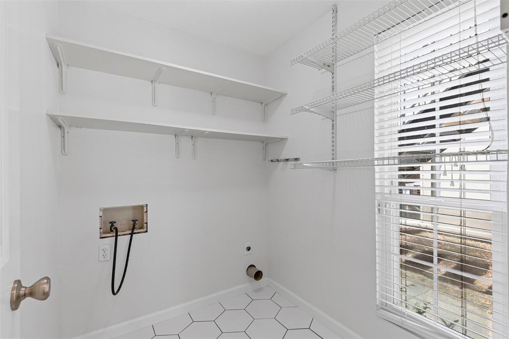 5981 Arapaho Road, Unit 703 Dallas, TX 75248 - Photo 16 of 19 Washroom with hookup for an electric dryer, hookup for a washing machine, and tile patterned flooring
