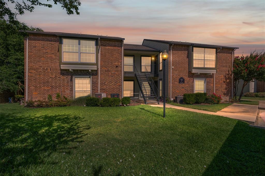 5981 Arapaho Road, Unit 703 Dallas, TX 75248 - Photo 3 of 19 Property at dusk featuring stairway