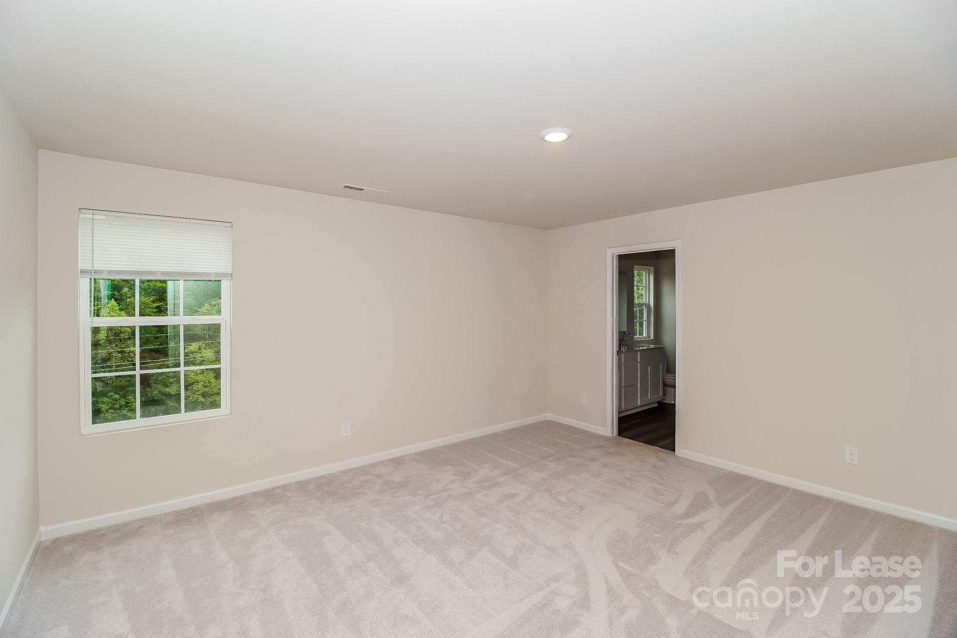 131 Arden Court Troutman, NC 28166 - Photo 11 of 23 an empty room with windows
