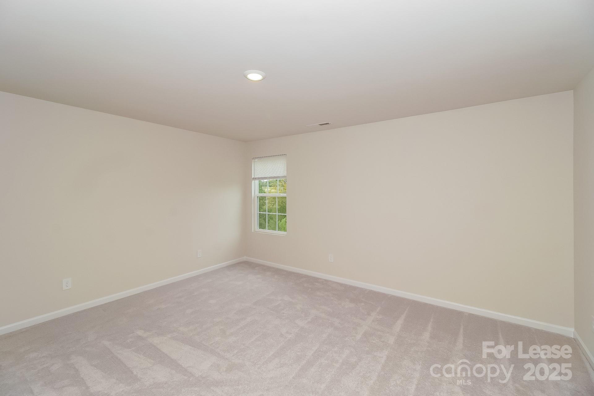 131 Arden Court Troutman, NC 28166 - Photo 12 of 23 a view of an empty room with a window