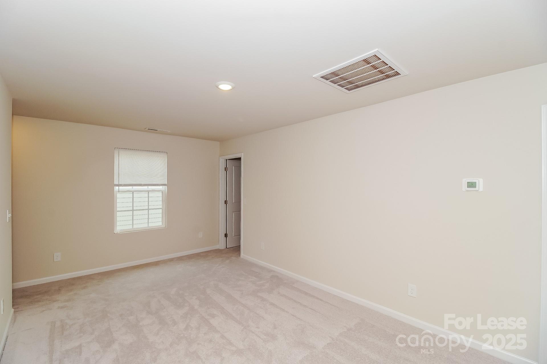 131 Arden Court Troutman, NC 28166 - Photo 14 of 23 an empty room with windows