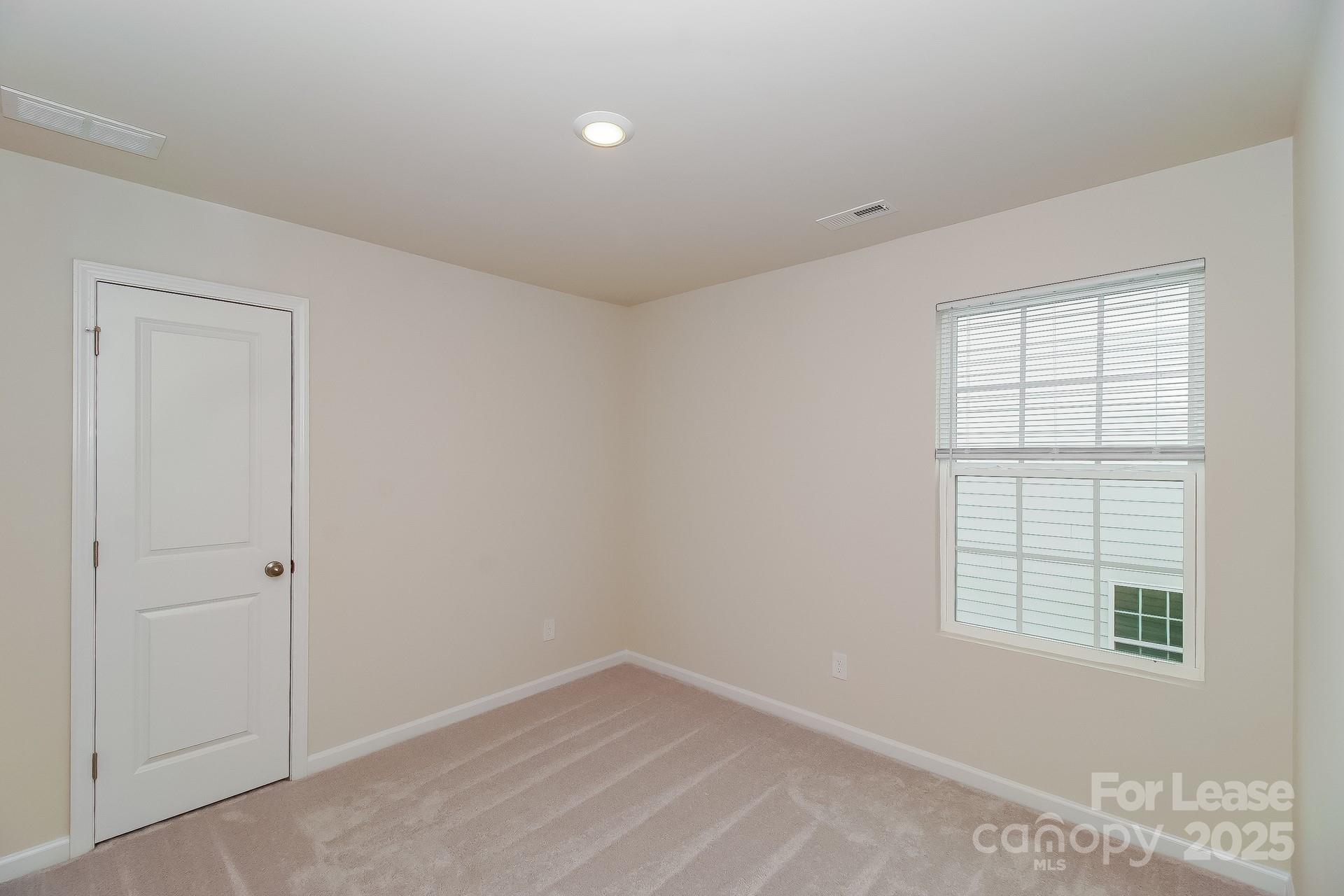 131 Arden Court Troutman, NC 28166 - Photo 15 of 23 an empty room with a window