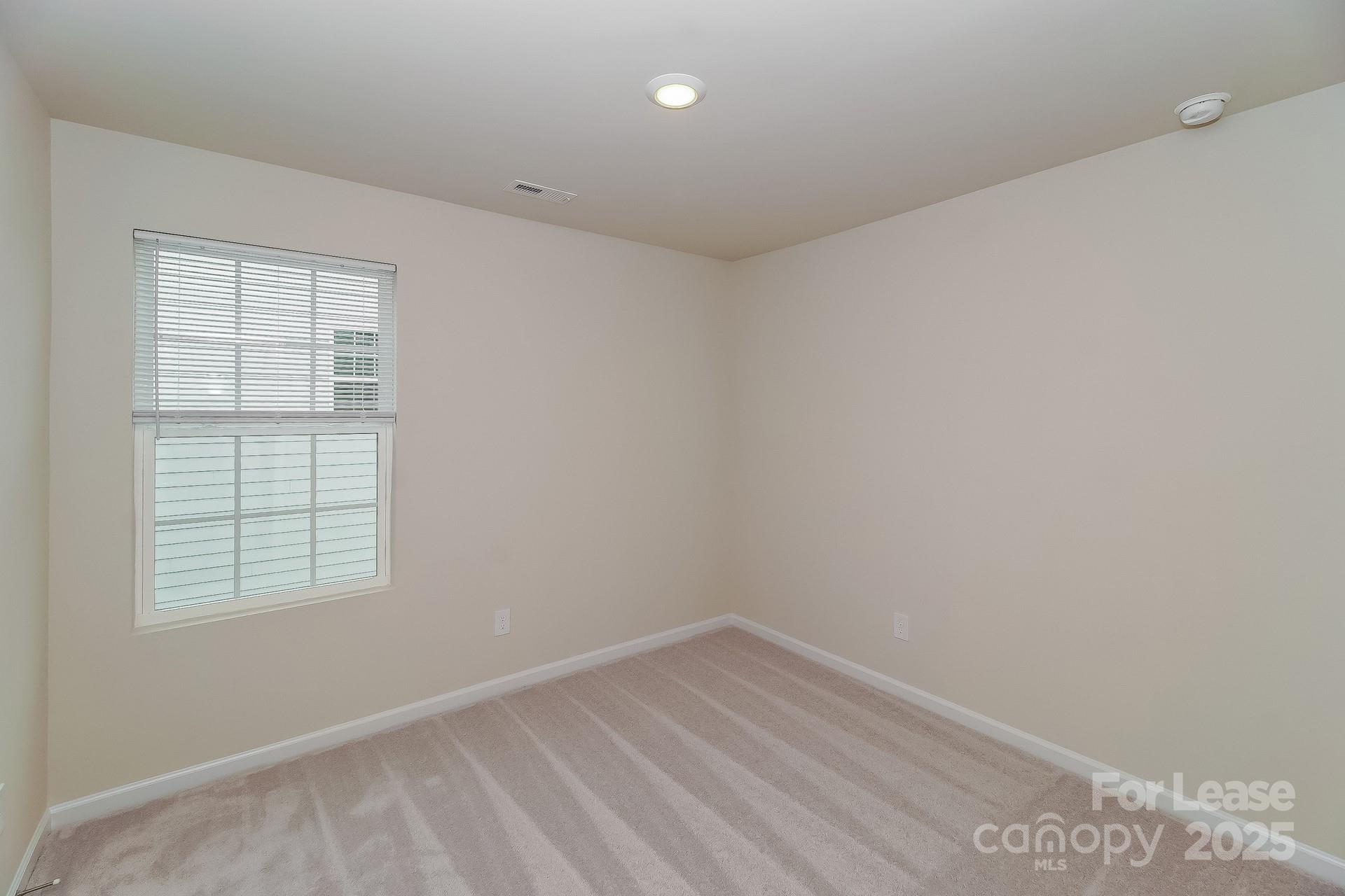 131 Arden Court Troutman, NC 28166 - Photo 16 of 23 an empty room with a window