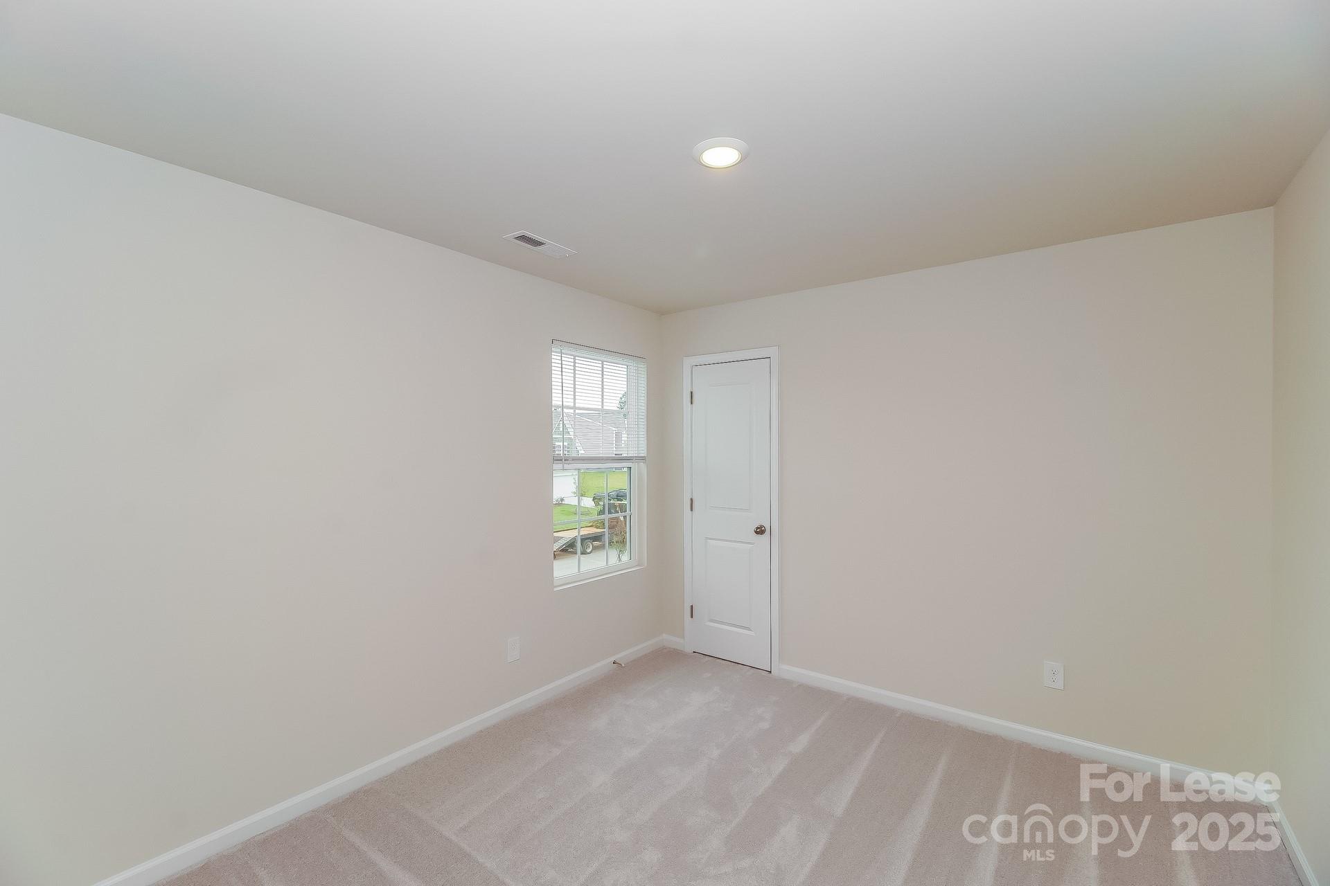 131 Arden Court Troutman, NC 28166 - Photo 17 of 23 a view of an empty room with a window