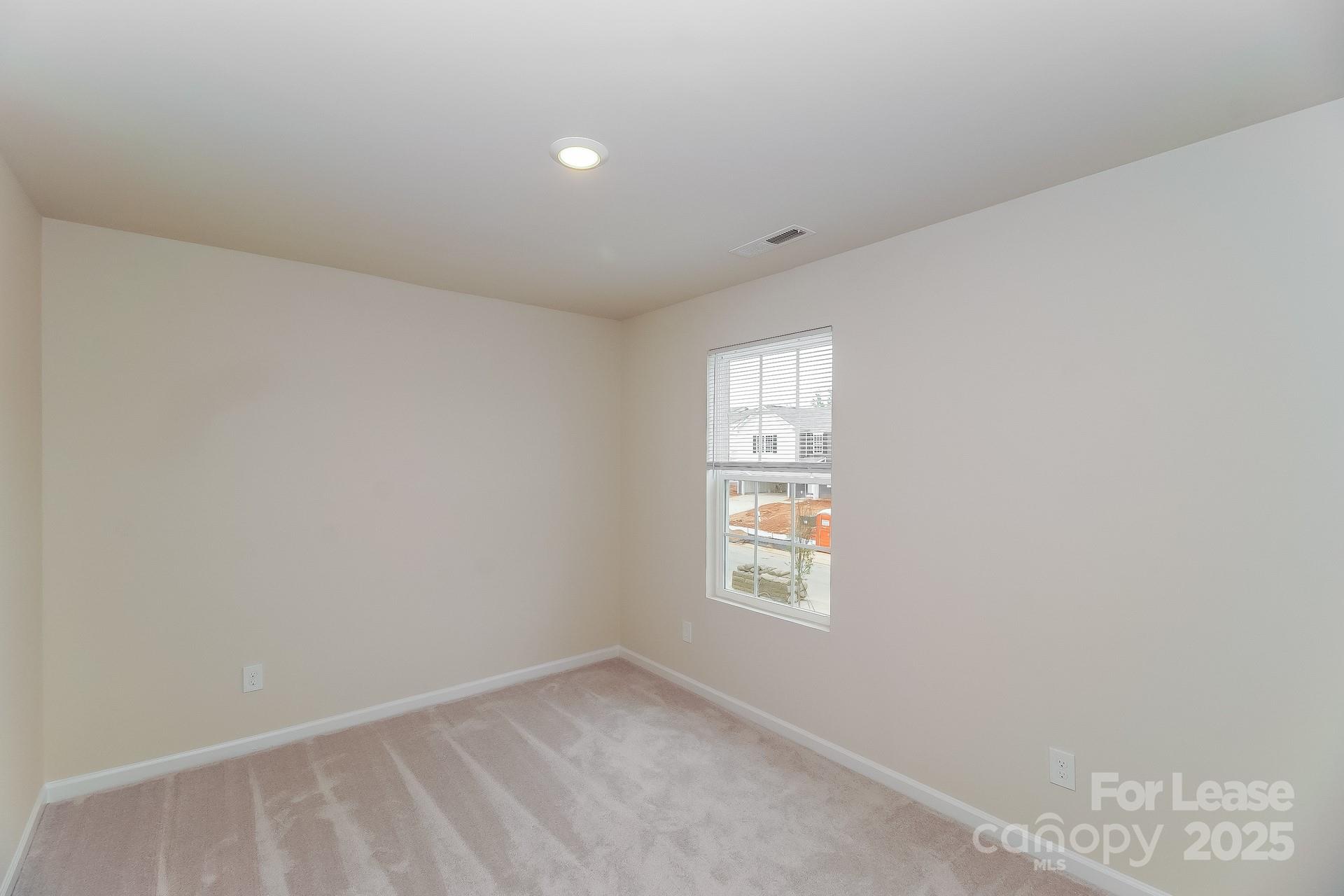 131 Arden Court Troutman, NC 28166 - Photo 18 of 23 an empty room with windows