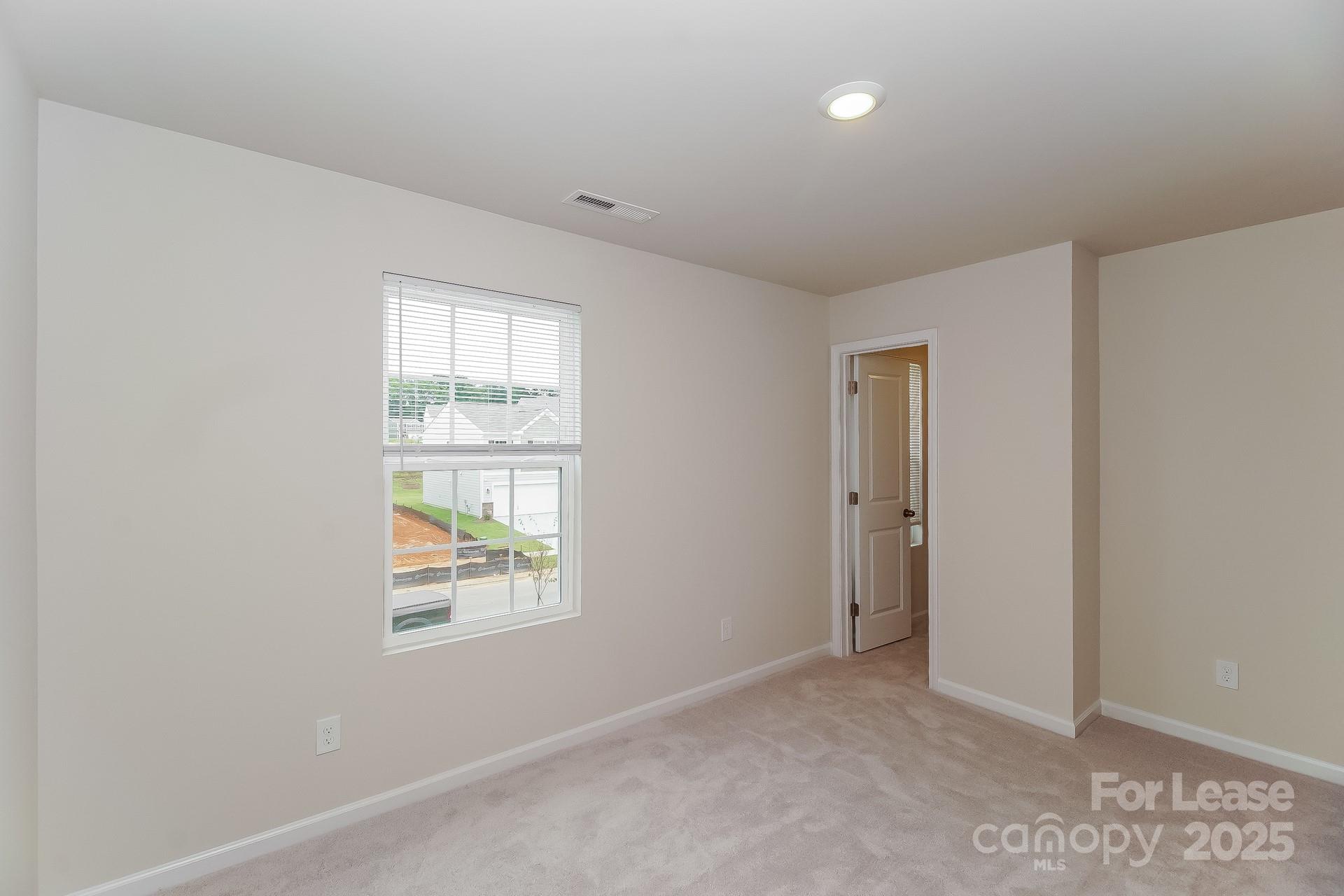 131 Arden Court Troutman, NC 28166 - Photo 19 of 23 an empty room with windows