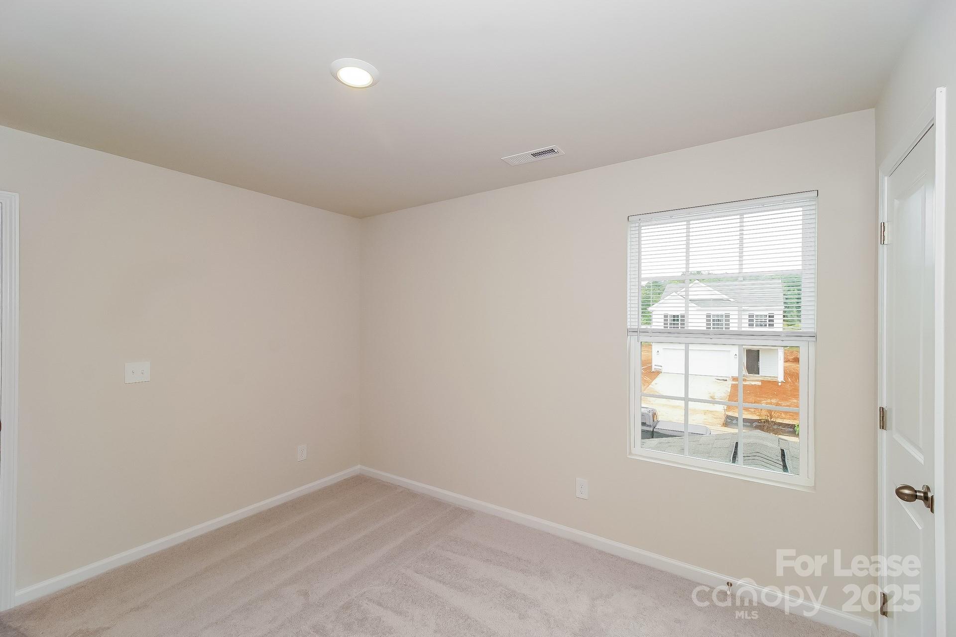 131 Arden Court Troutman, NC 28166 - Photo 20 of 23 an empty room with a window