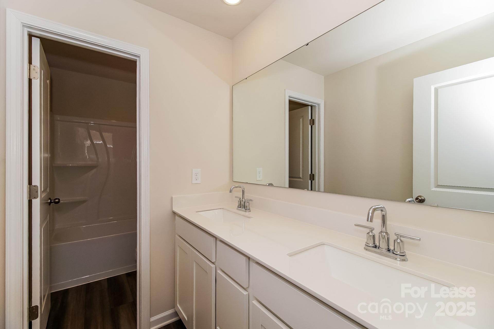 131 Arden Court Troutman, NC 28166 - Photo 21 of 23 a bathroom with a sink and a mirror