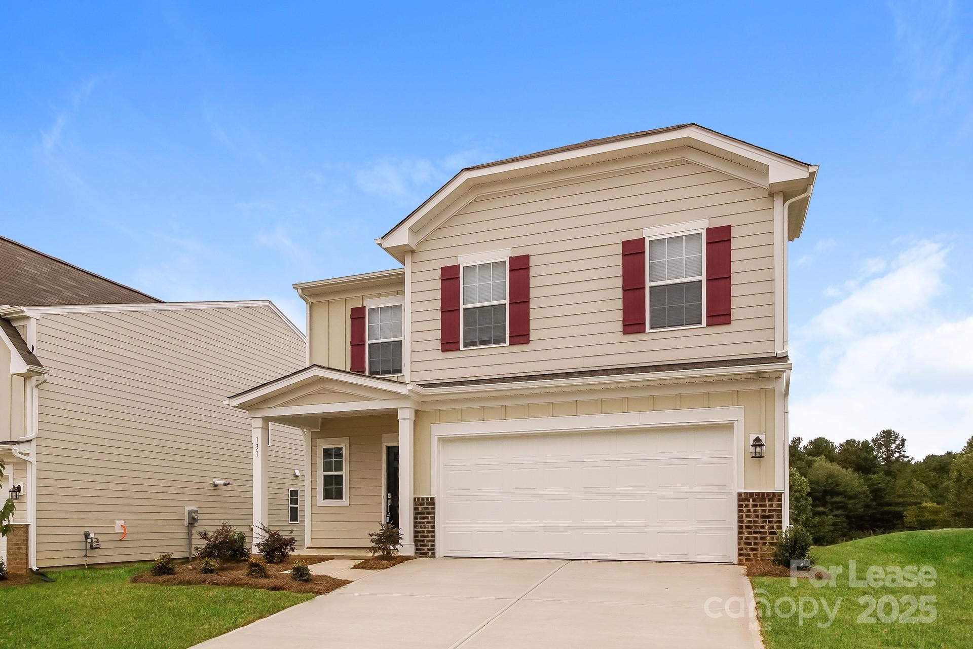 131 Arden Court Troutman, NC 28166 - Photo 5 of 23 a view of a house with a yard