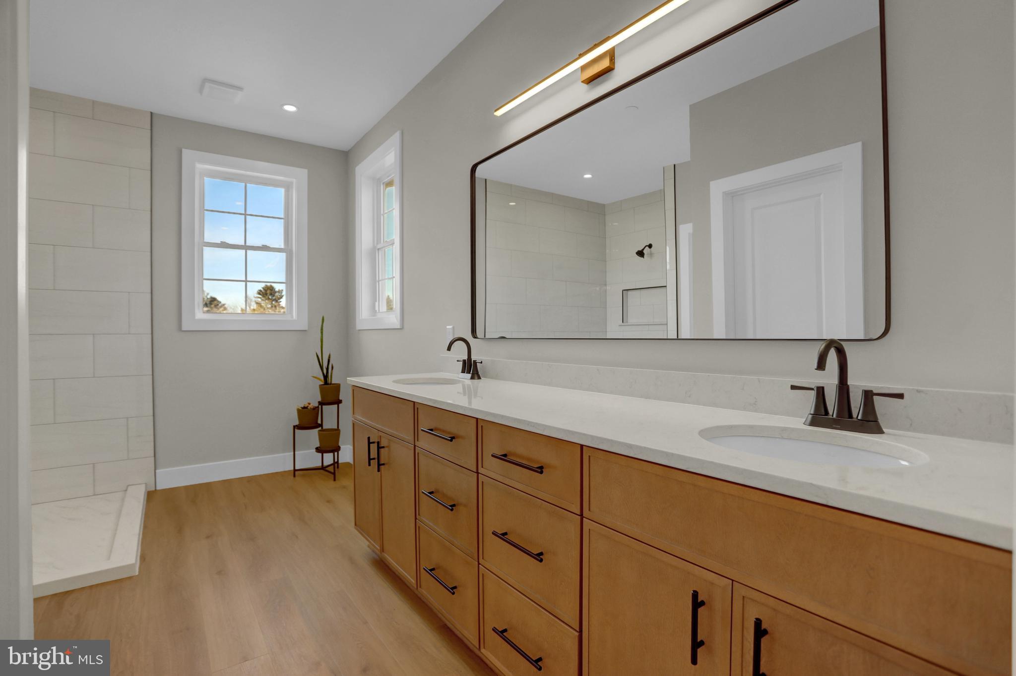 3544 Revolea Beach Road Middle River, MD 21220 - Photo 19 of 28 a bathroom with double sink and a mirror