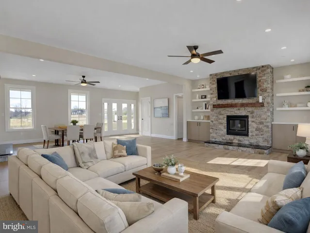 a living room with furniture fireplace and a flat screen tv