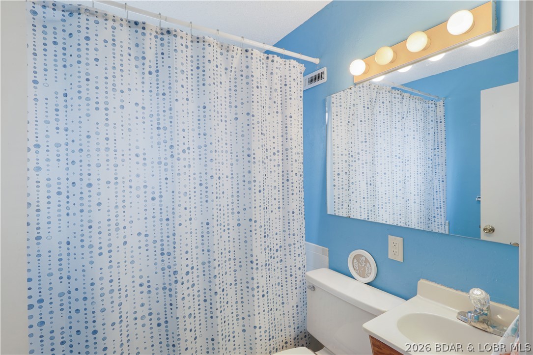 29966 Oak Knoll Road Rocky Mount, MO 65072 - Photo 30 of 68 Full common bathroom on the upper entry level of t