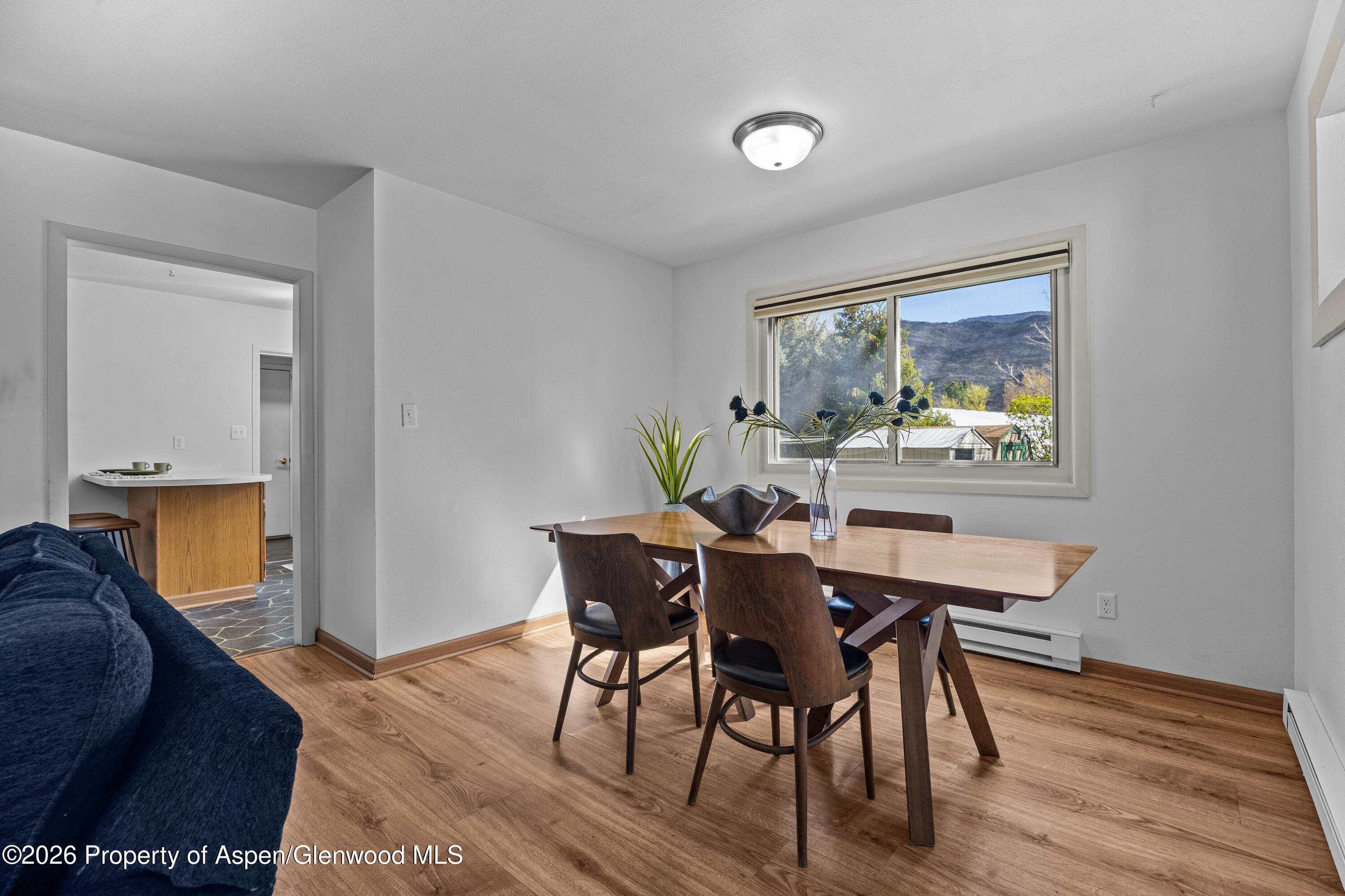 128 Hopi Carbondale, CO 81623 - Photo 11 of 34 a view of a dining room with furniture window and wooden floor