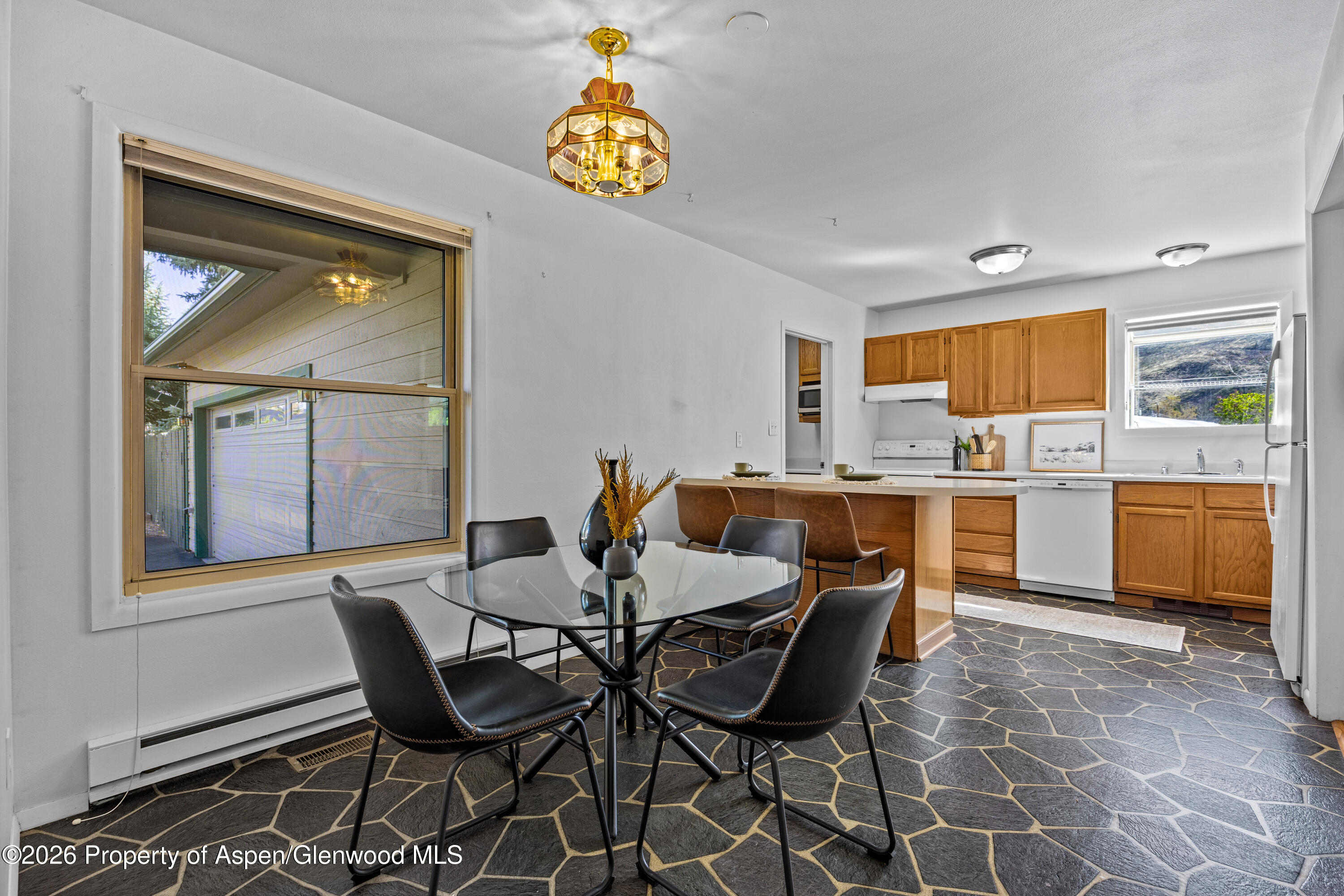 128 Hopi Carbondale, CO 81623 - Photo 12 of 34 a view of a dining room with furniture and a window