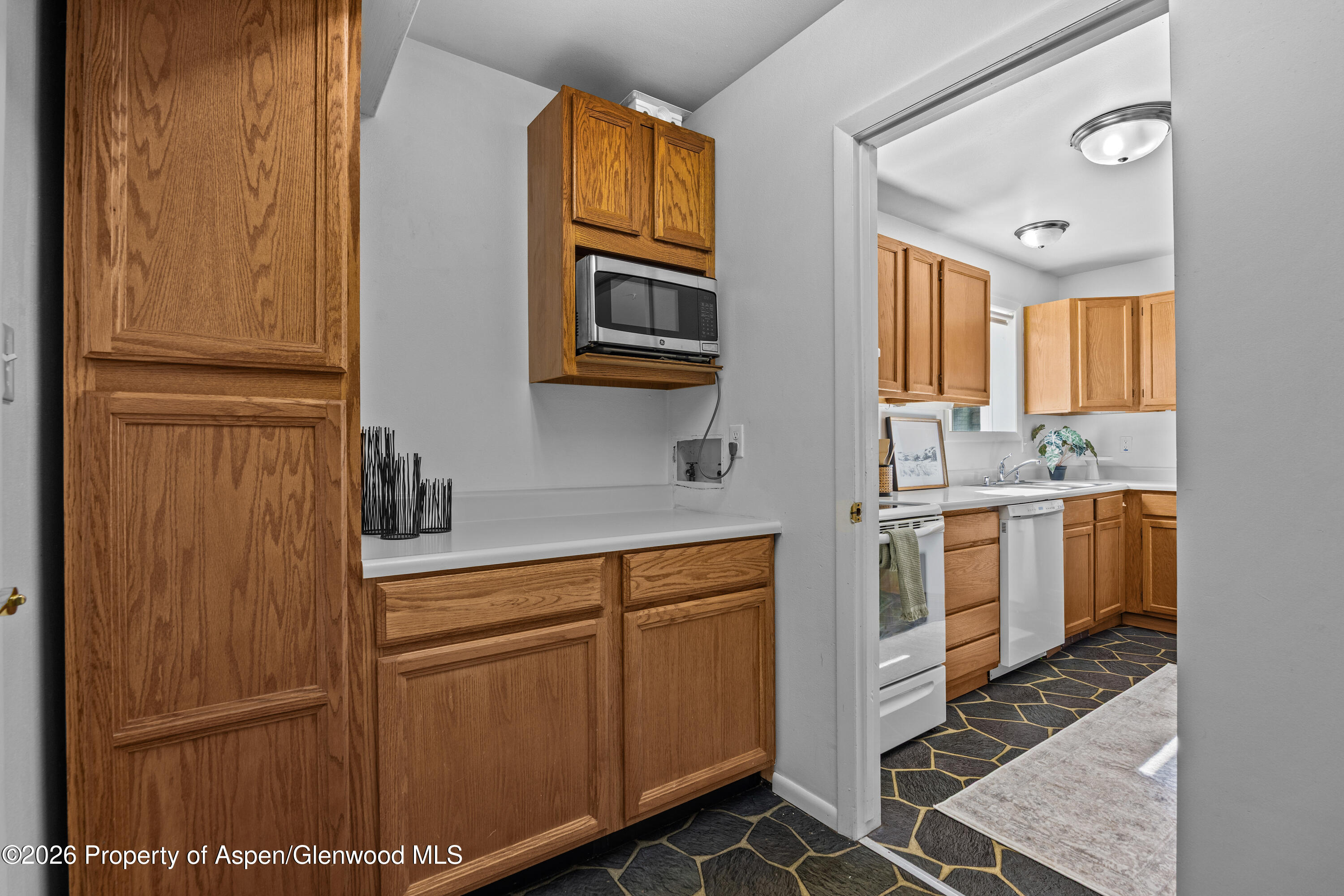 128 Hopi Carbondale, CO 81623 - Photo 15 of 34 a kitchen with stainless steel appliances a refrigerator and cabinets