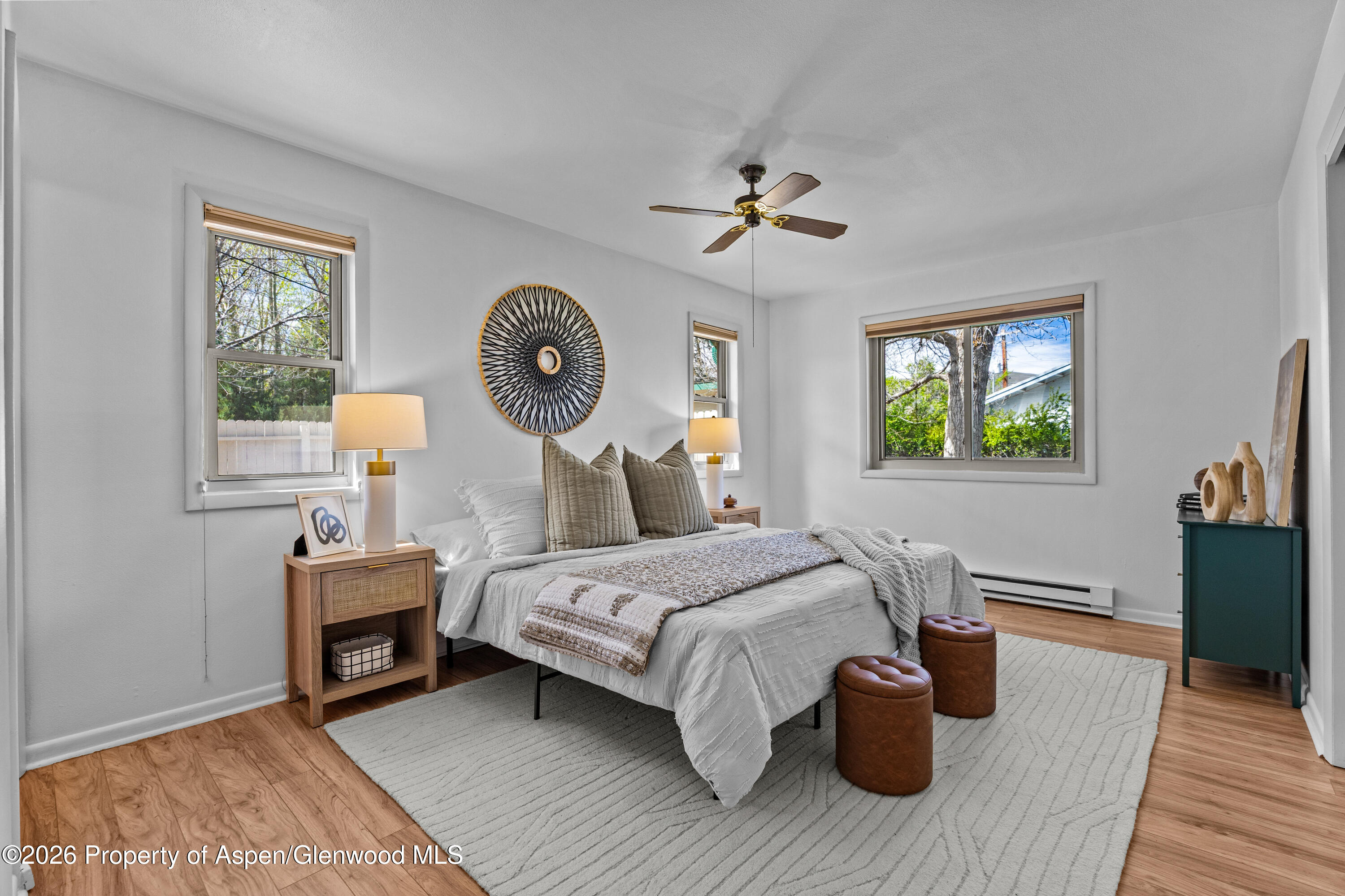 128 Hopi Carbondale, CO 81623 - Photo 17 of 34 a bedroom with a bed a window and dresser