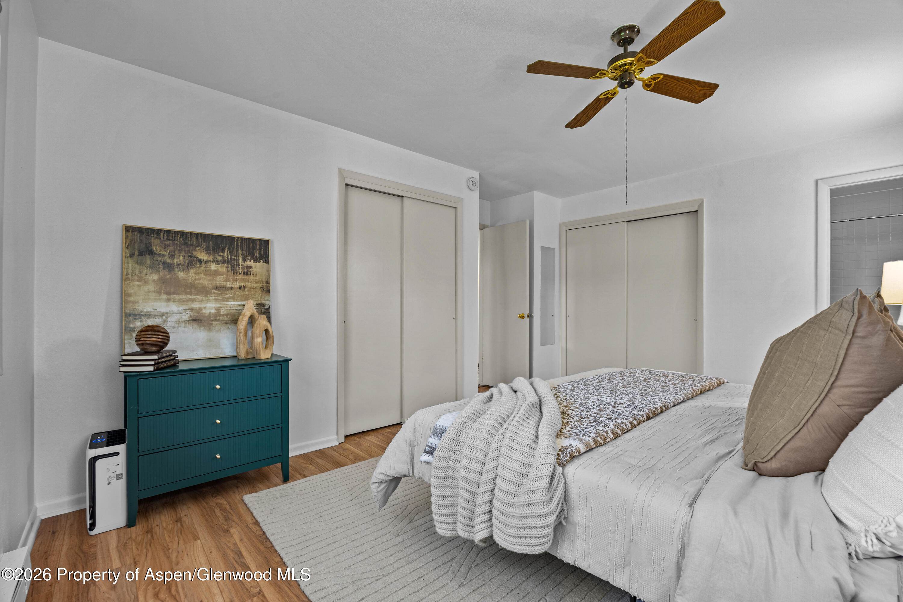 128 Hopi Carbondale, CO 81623 - Photo 18 of 34 a bedroom with a bed and a dresser