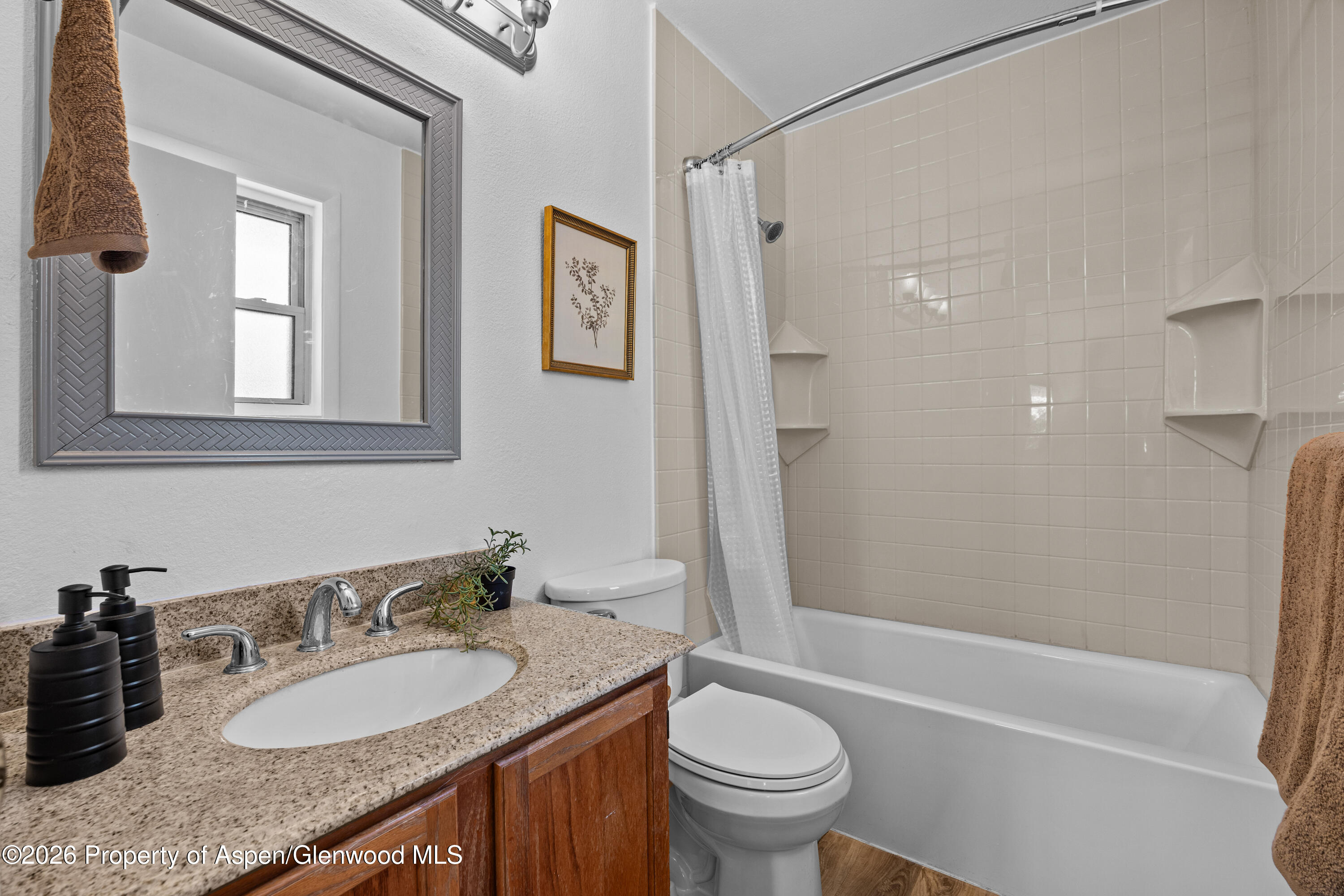 128 Hopi Carbondale, CO 81623 - Photo 19 of 34 a bathroom with a granite countertop sink toilet and shower
