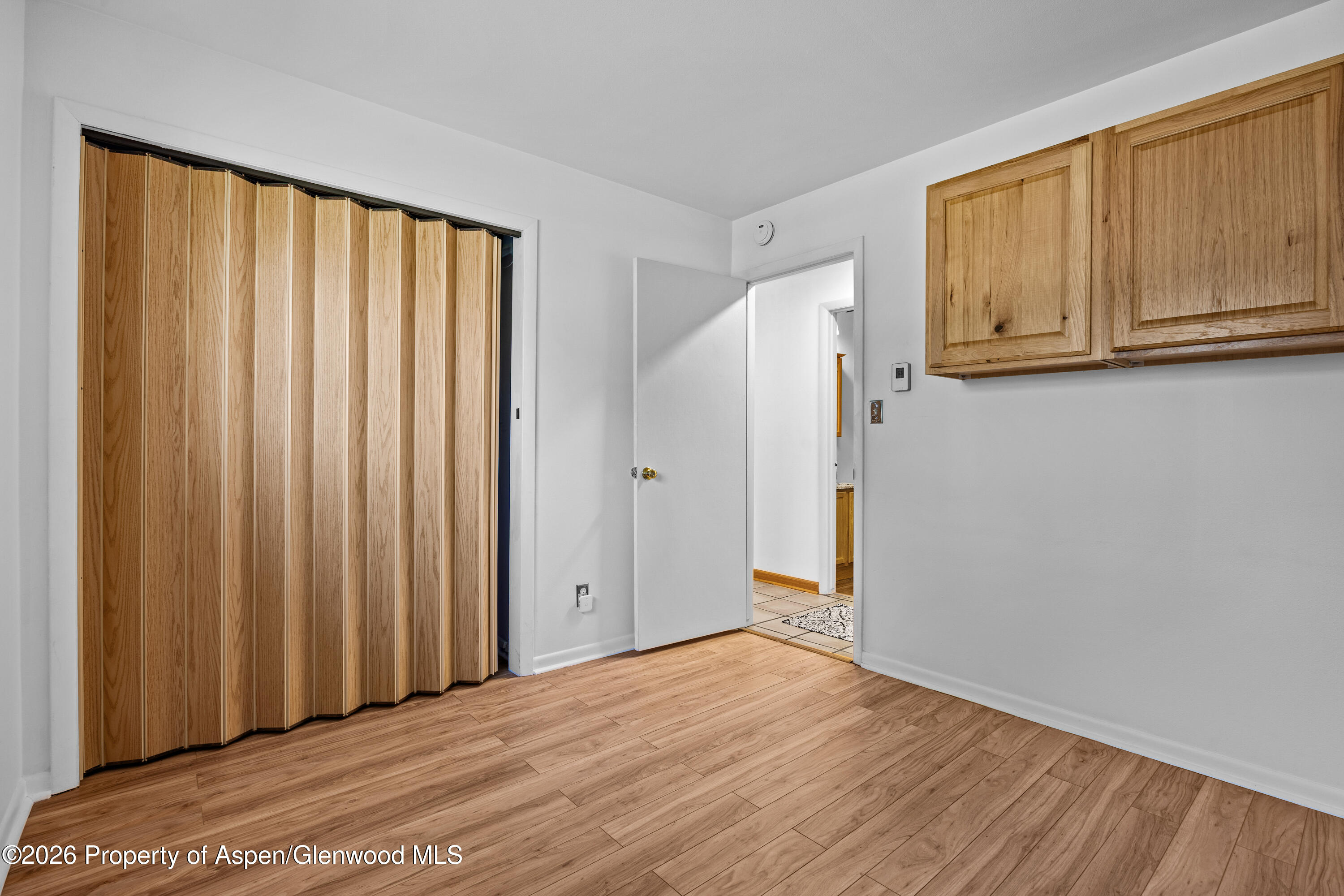 128 Hopi Carbondale, CO 81623 - Photo 21 of 34 a view of an empty room with wooden floor and a window