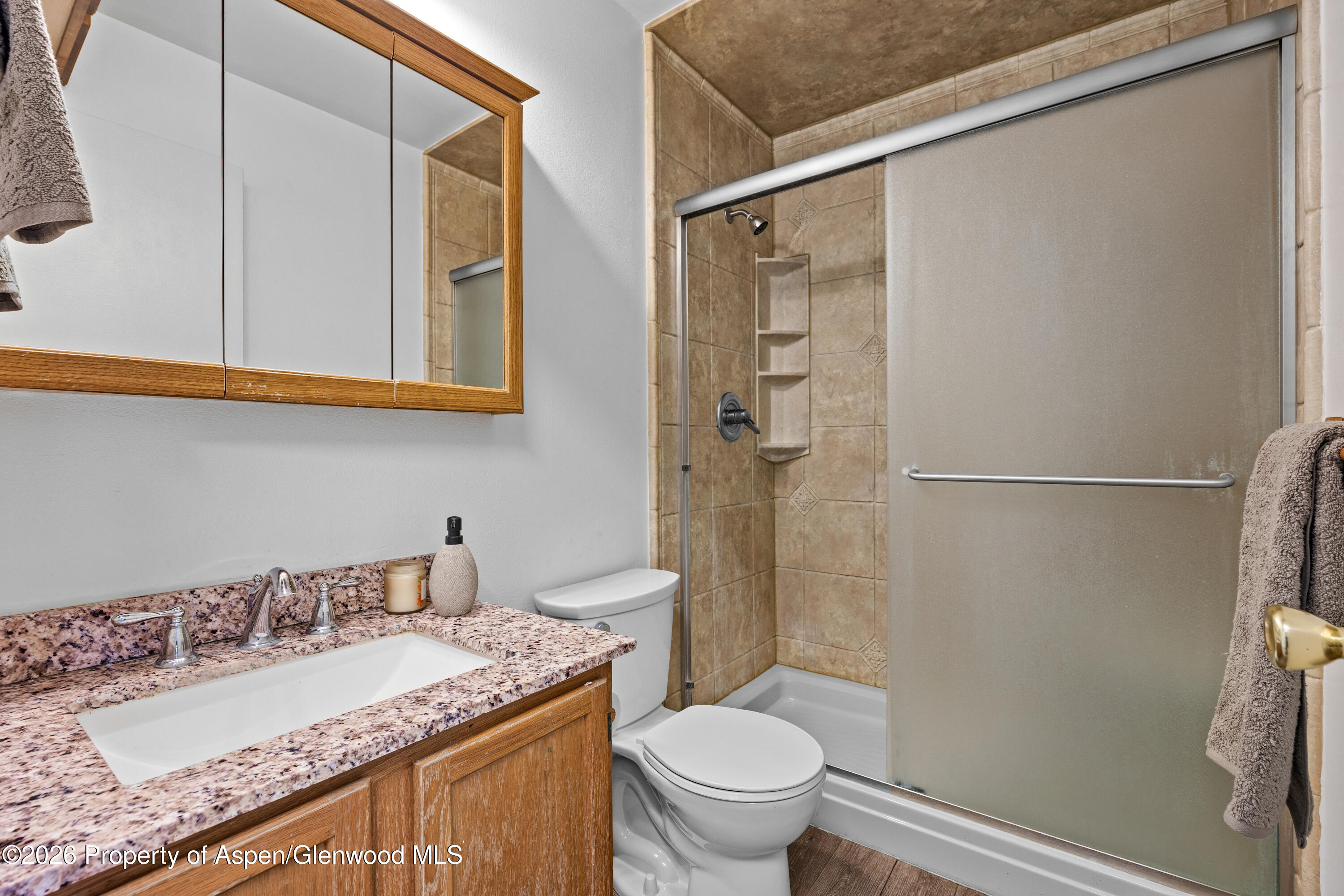 128 Hopi Carbondale, CO 81623 - Photo 22 of 34 a bathroom with a granite countertop sink toilet and shower