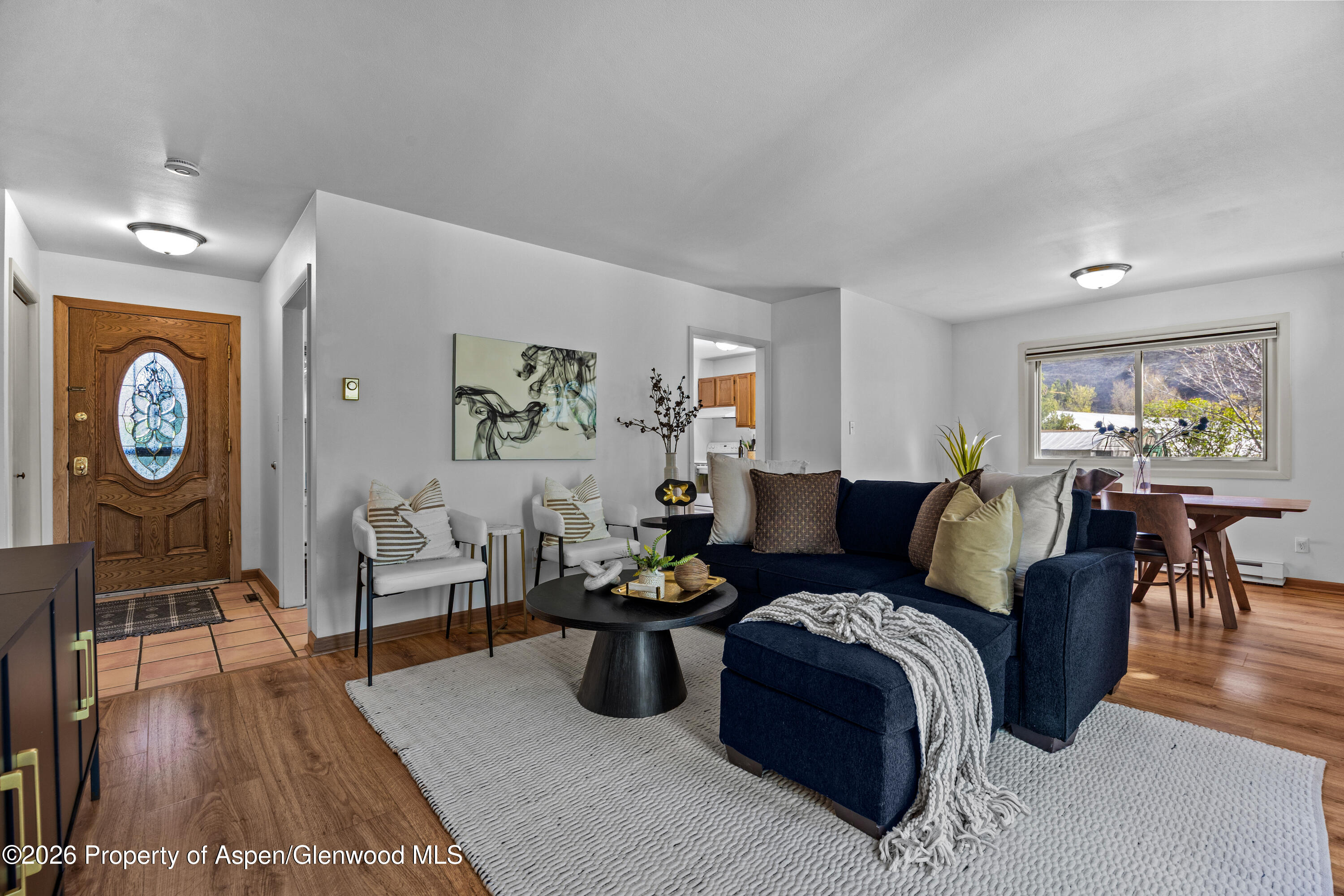 128 Hopi Carbondale, CO 81623 - Photo 6 of 34 a living room with furniture a rug and wall painting
