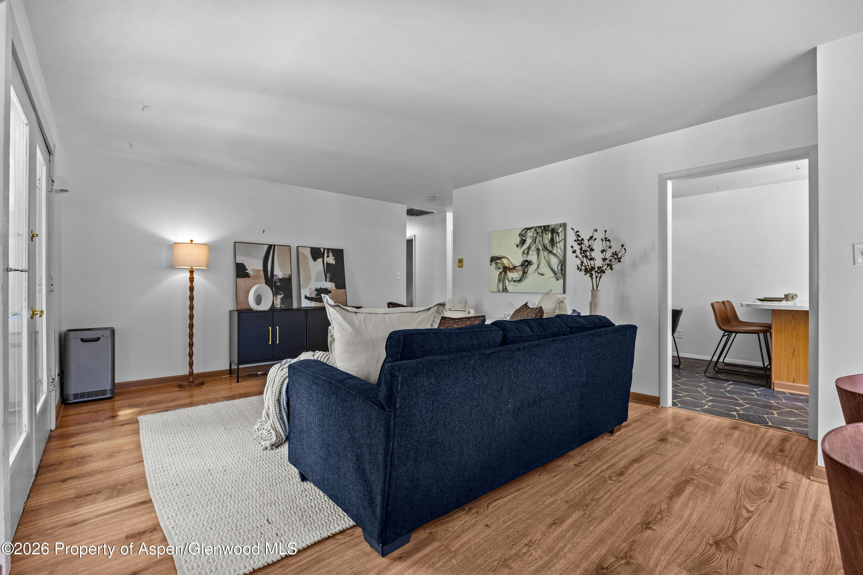 128 Hopi Carbondale, CO 81623 - Photo 7 of 34 a living room with furniture and a wooden floor