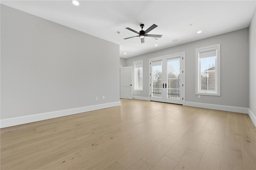 5133 Fifth Avenue Pittsburgh, PA 15232 - Photo 21 of 43 an empty room with wooden floor fan and windows