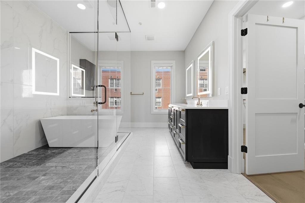 5133 Fifth Avenue Pittsburgh, PA 15232 - Photo 23 of 43 a view of a bathroom with a bathtub and shower