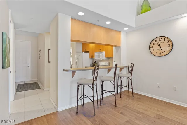 a view of a room with furniture and wooden floor