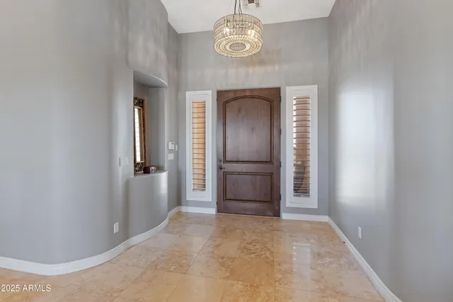 a white bath tub sitting in a bathroom next to a window