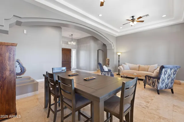 a bedroom with a bed and a television