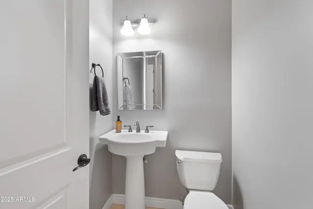 a view of a bathroom from a hallway