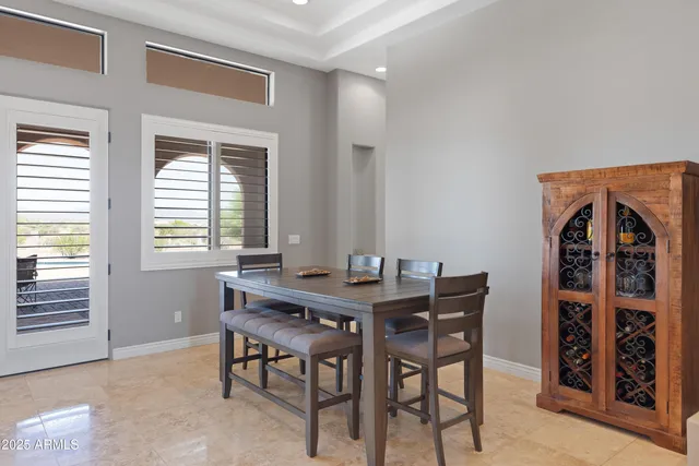a view of a dining room with furniture and window