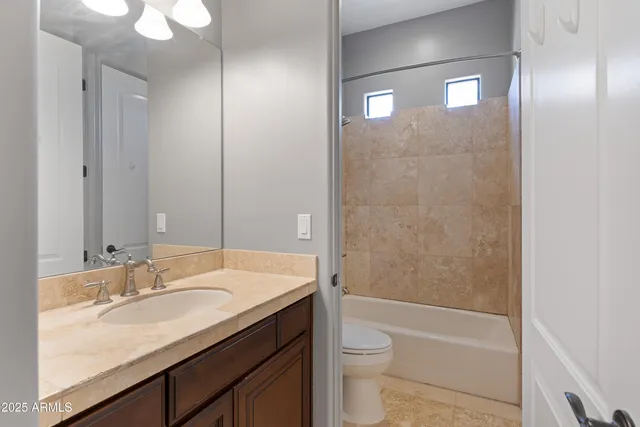 a view of a small house in middle of the backyard