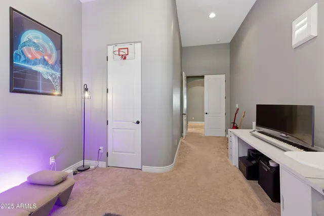 an aerial view of residential houses with outdoor space and ocean