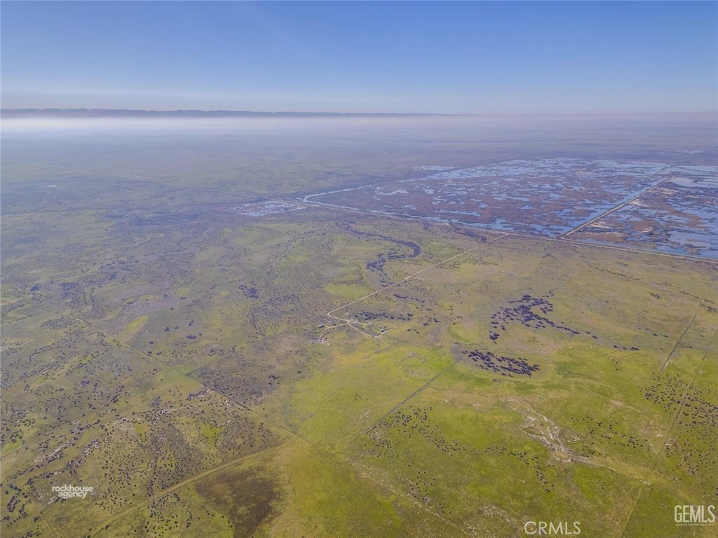 11484 Corcoran Road Wasco, CA 93280 - Photo 15 of 16 a view of a big yard with an ocean