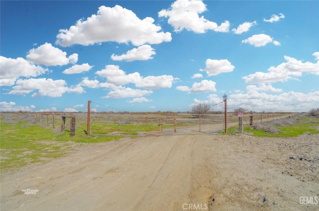 11484 Corcoran Road Wasco, CA 93280 - Photo 3 of 16 a view of a lake and trees in the background