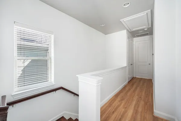 a view of a balcony with wooden floor