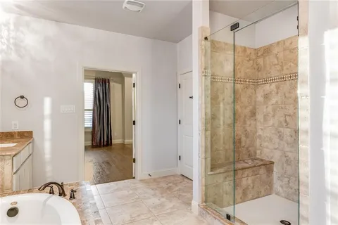 a bathroom with a shower and a sink