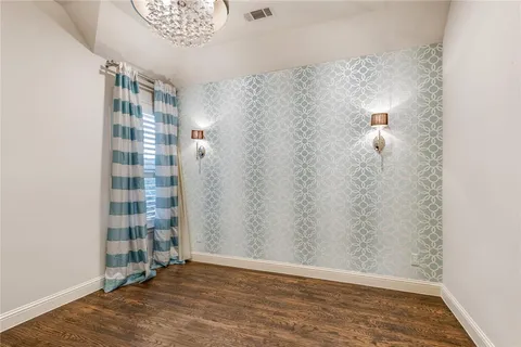a view of a bathroom with wooden floor and a shower