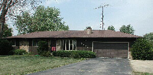 2890 Karr Road Belvidere, IL 61008 - Photo 1 of 1 a front view of a house with garden