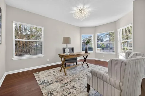 a bedroom with a bed and flat screen tv