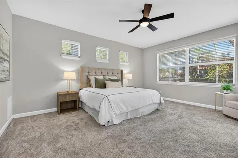 a spacious bathroom with a tub sink and shower